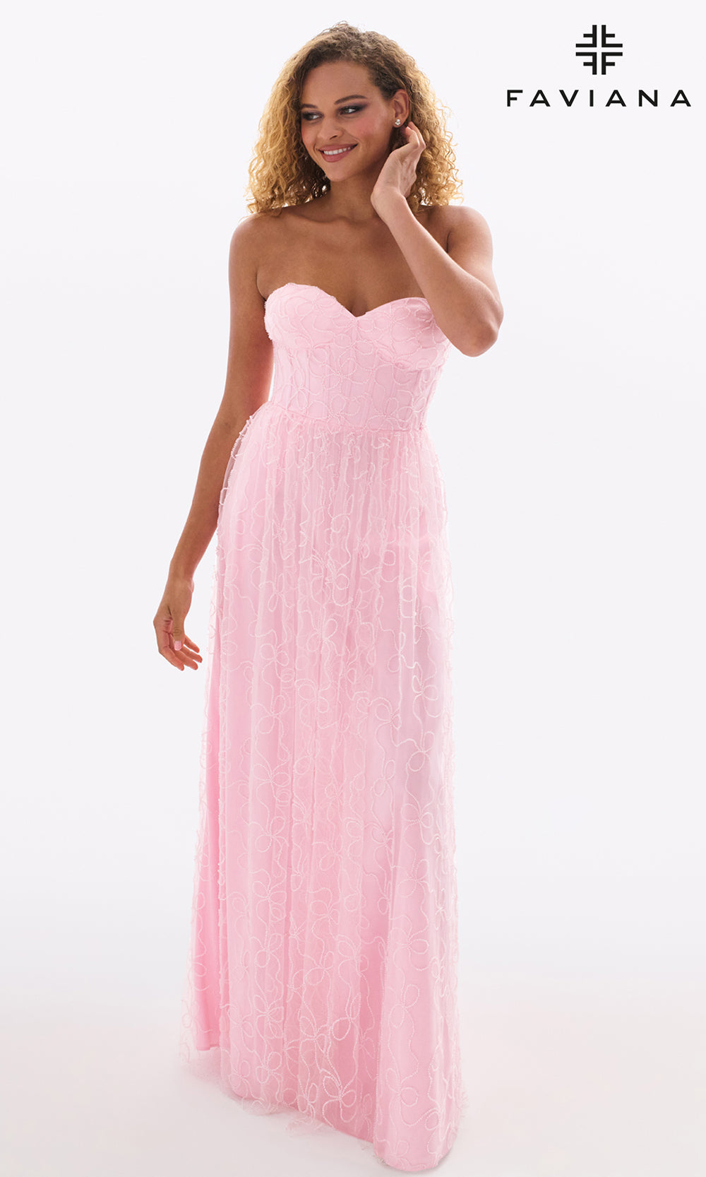 Woman wearing a pink strapless gown with Faviana logo