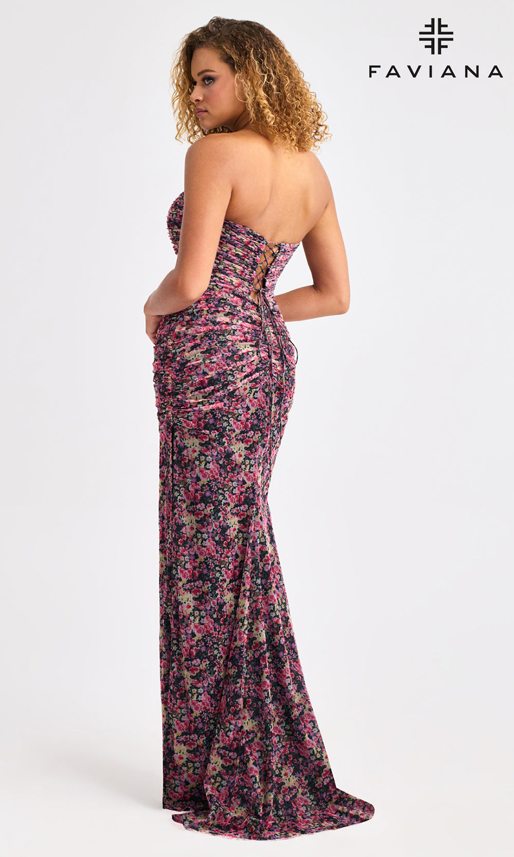 Woman wearing a floral strapless gown with Faviana branding on a white background