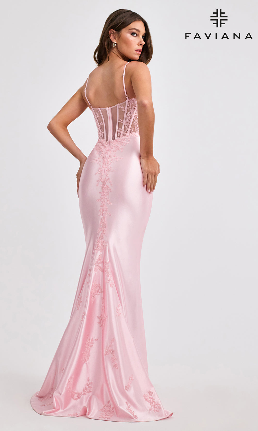 Pink evening gown with lace detailing on a white background, featuring the Faviana brand.