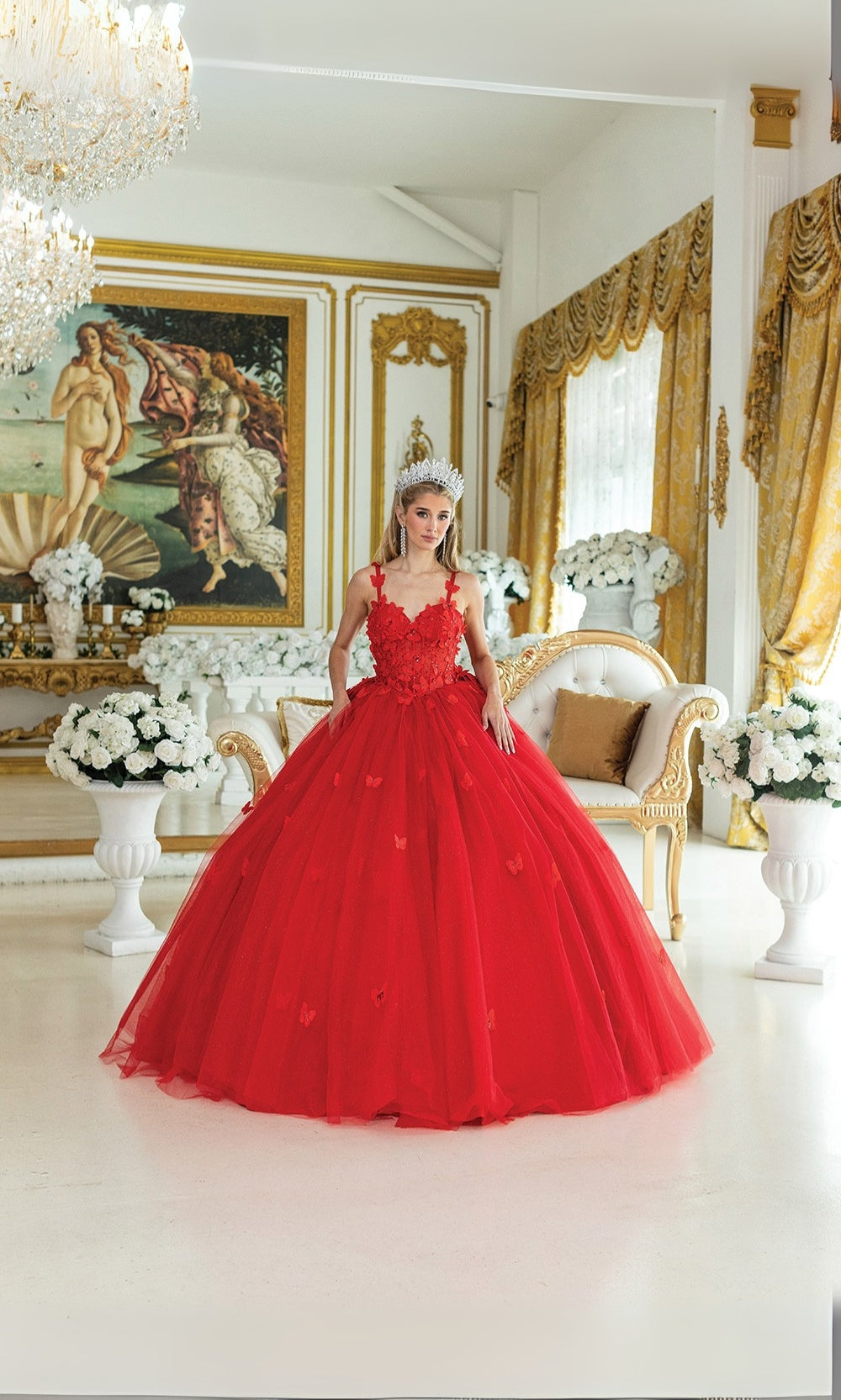 Woman in a red ball gown standing in an elegant room with gold accents and classical art.