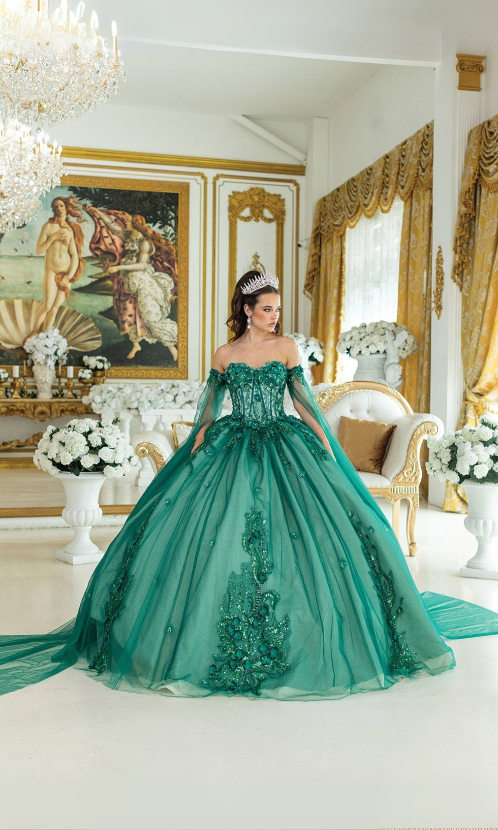 Woman in a green ball gown standing in an opulent room with gold accents and classical decor.