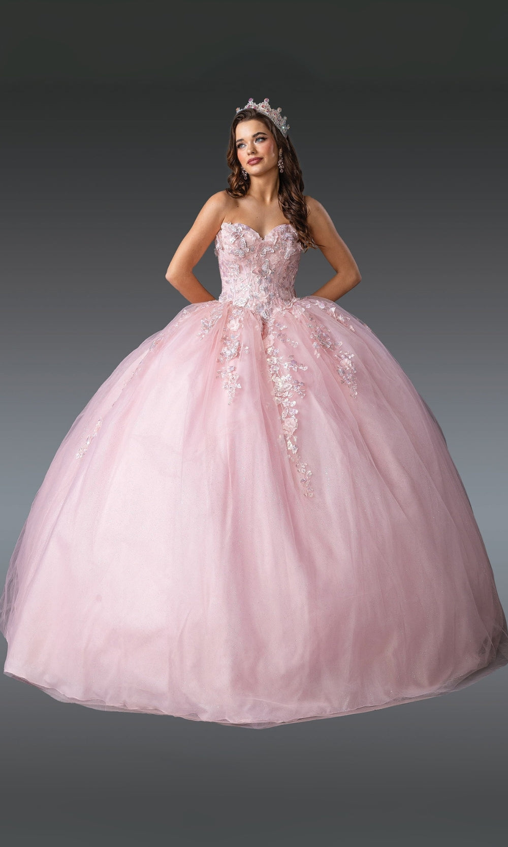 Pink ball gown with floral details on a gray background