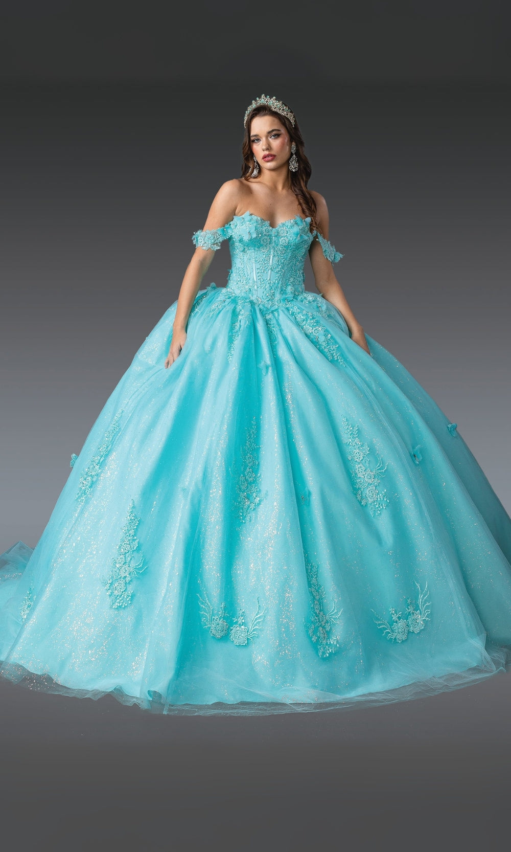 Turquoise ball gown with floral details on a gray background