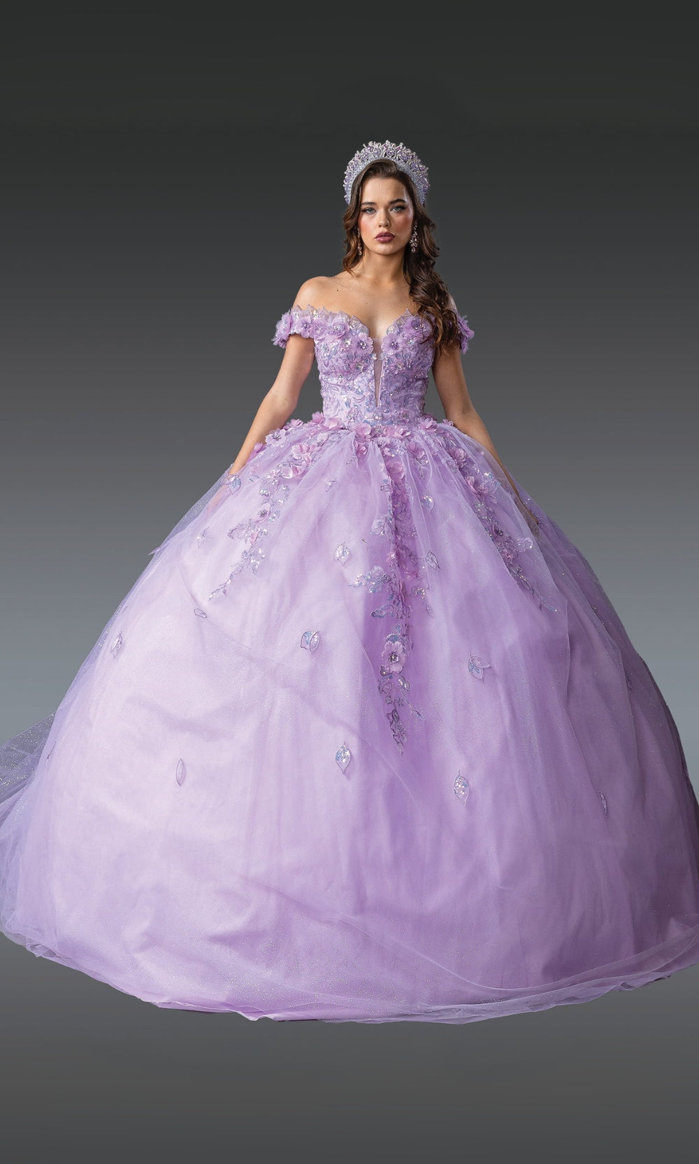 Woman wearing a purple ball gown with floral details on a dark background