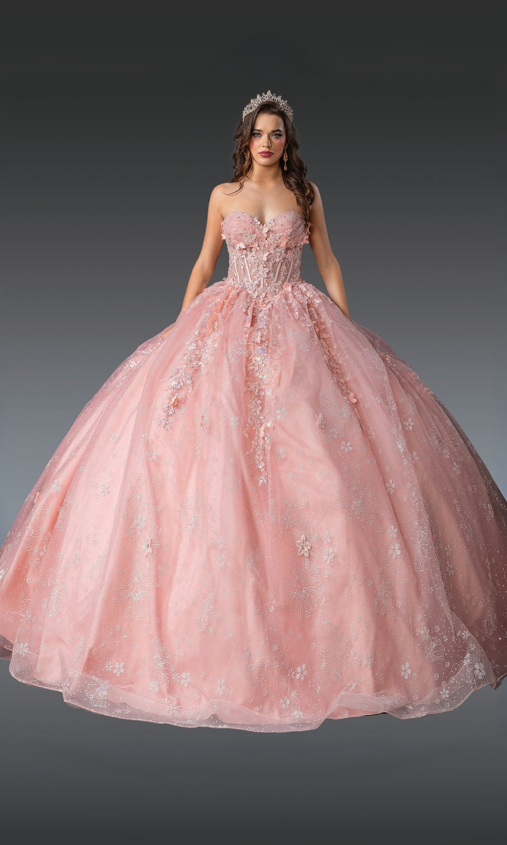 Pink ball gown with floral details on a gray background