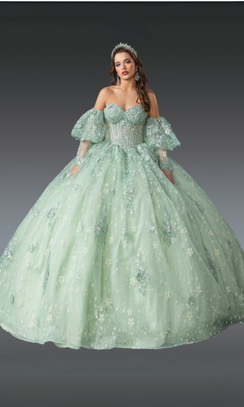 Mint green ball gown with floral details on a gray background