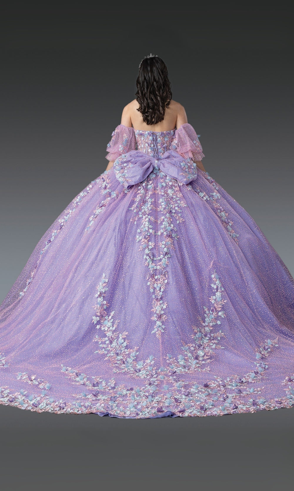 Purple floral gown on a plain background