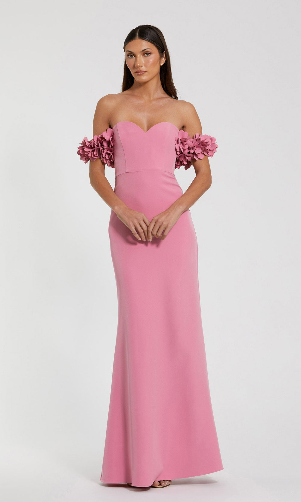 Mac Duggal 56131 rose-pink front view prom gown with stretch jersey, sculptural floral off-shoulder sleeves, fitted floor-length silhouette, red carpet styling