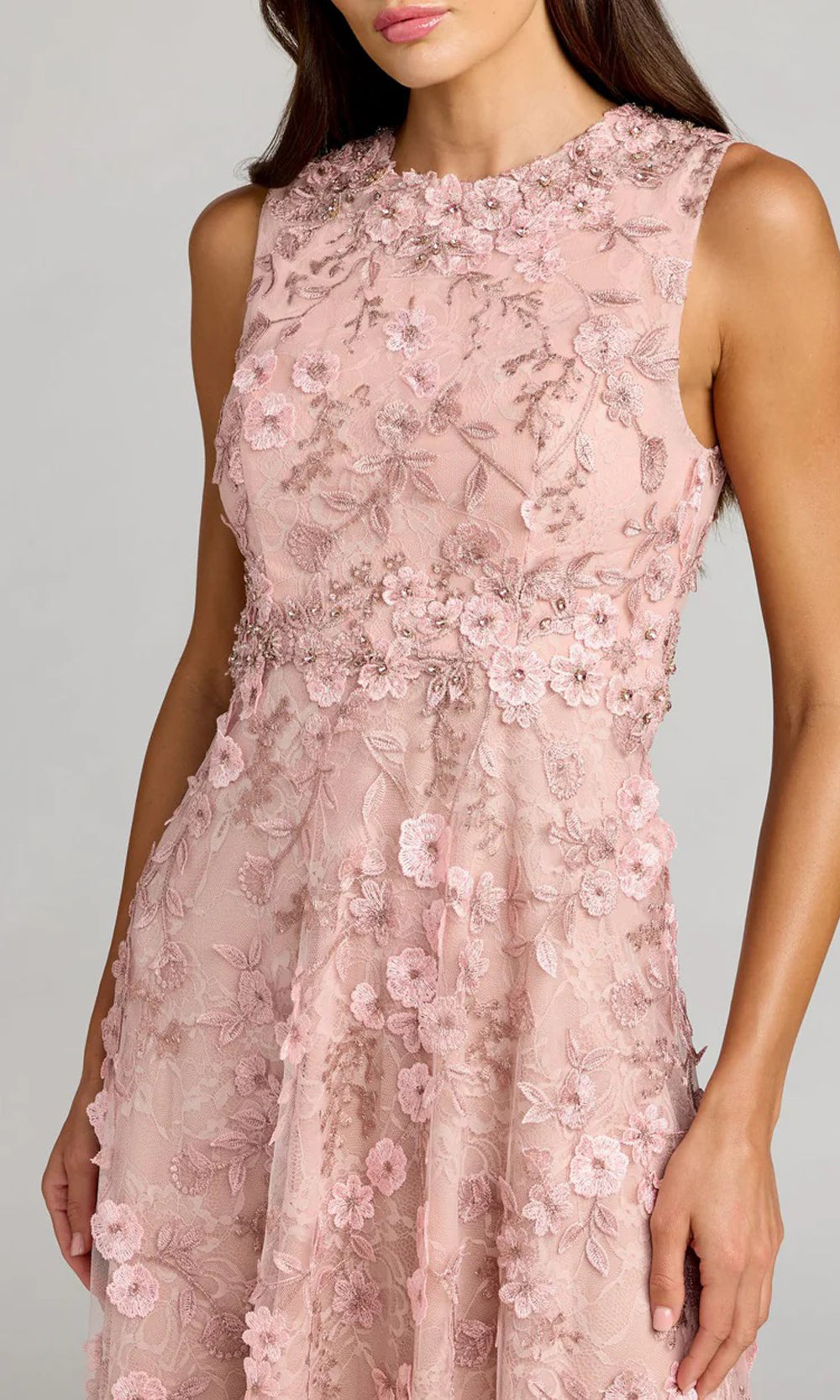 Mac Duggal 69192 rose pink detail view wedding guest dress showing 3D raised floral lace appliqués, embroidery texture, crystal waist trim, black-tie event dress worn to wedding-guest events