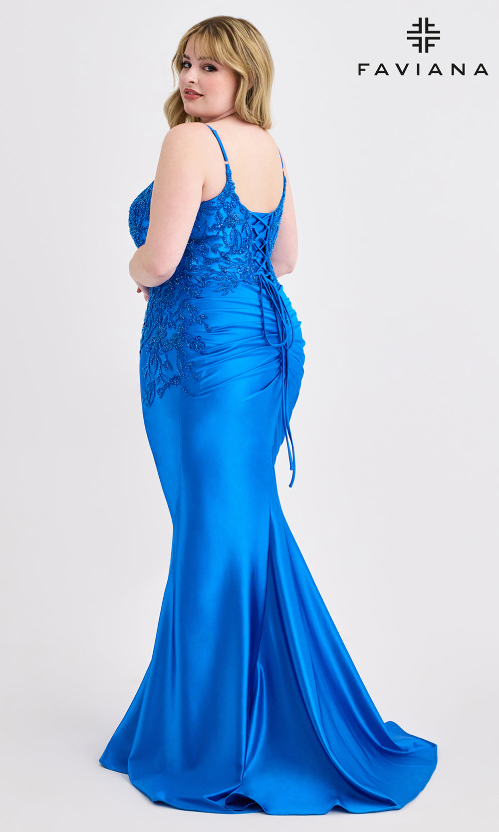 Blue evening gown with lace detailing on a white background, featuring the Faviana brand.