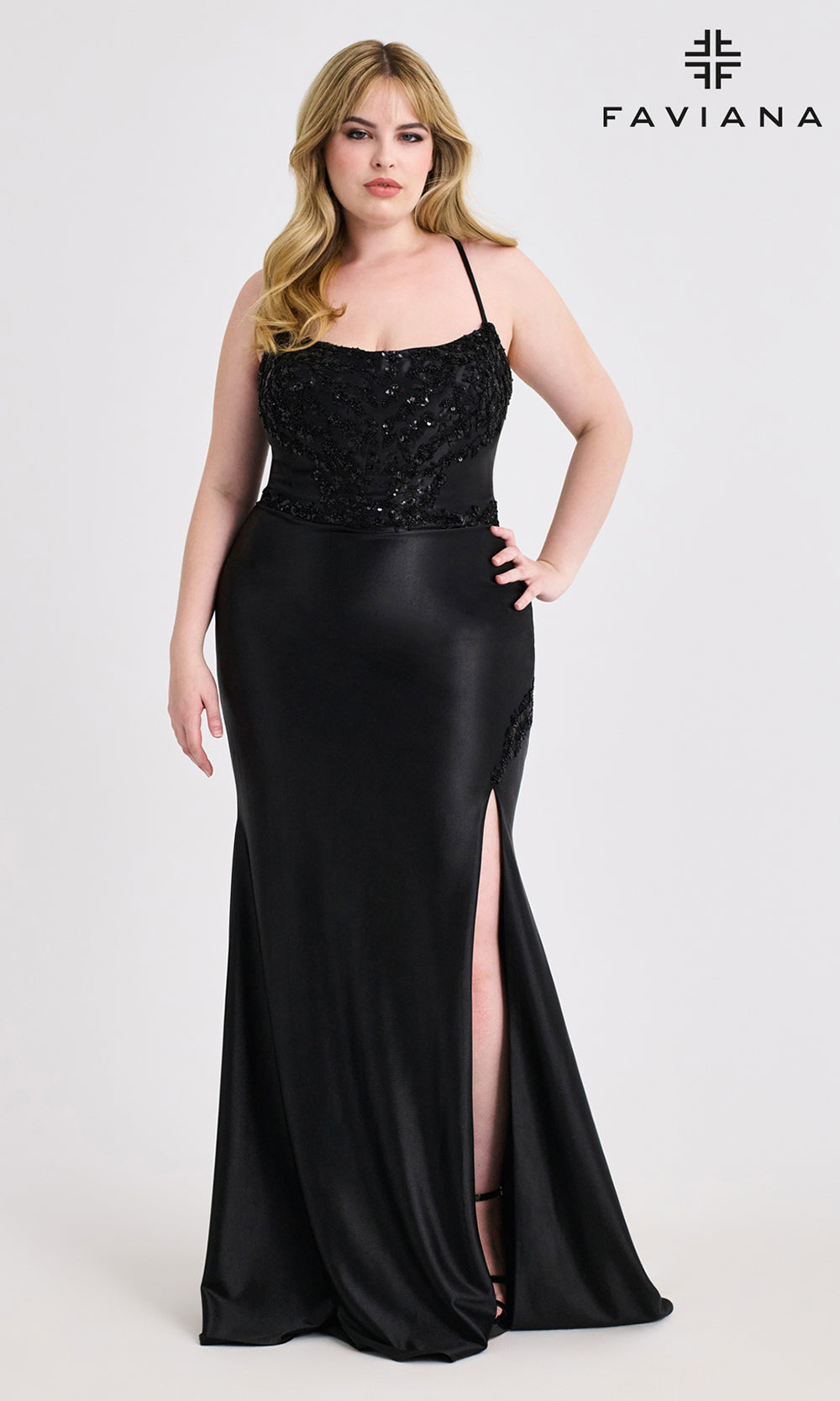 Woman wearing a black evening gown with a high slit, branded 'Faviana', on a white background.