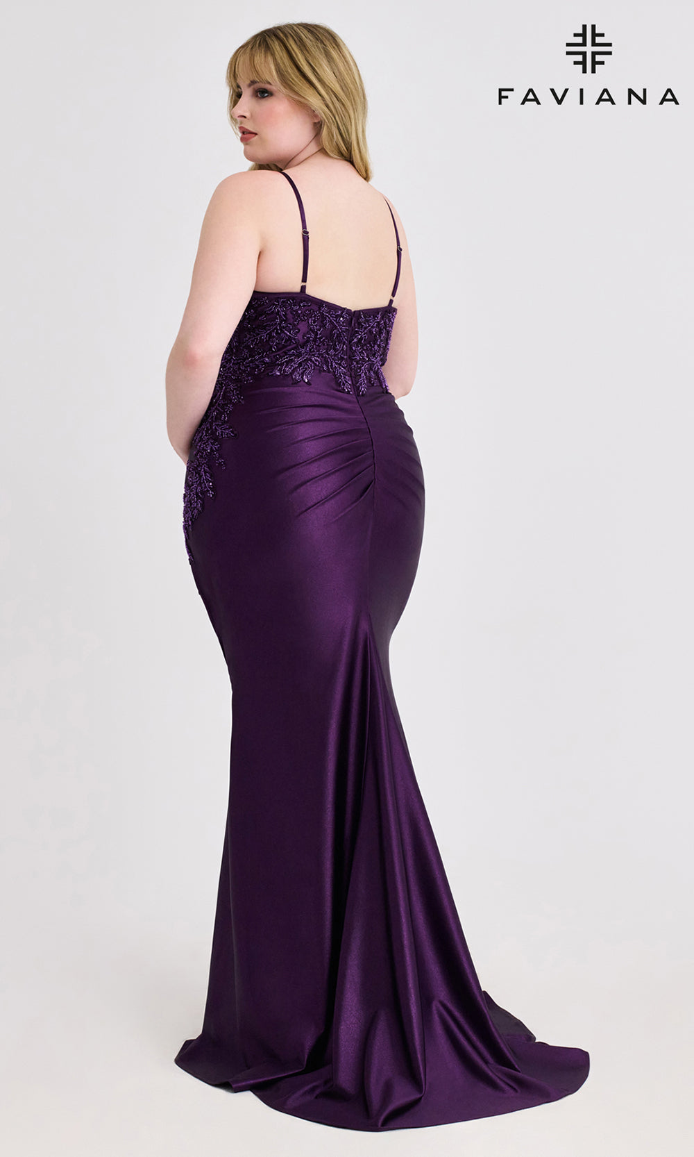 Purple evening gown with lace detailing on a white background, featuring the Faviana brand.
