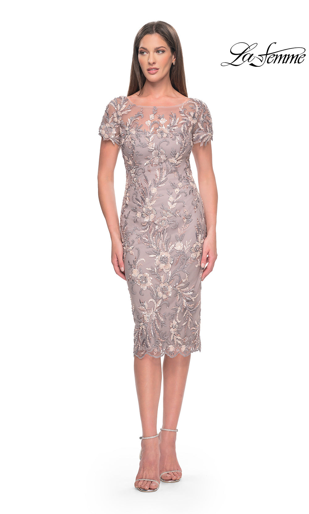 Woman wearing a silver lace dress on a white background with 'La Femme' branding.