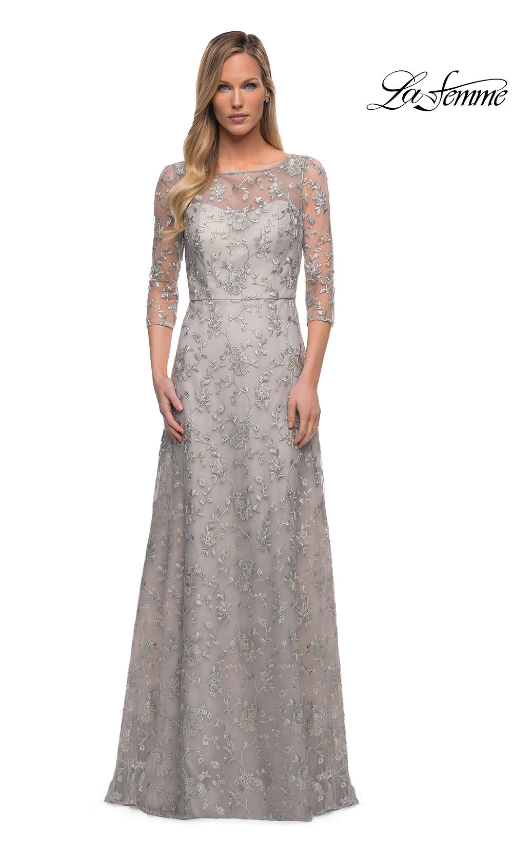 Silver evening gown with lace detailing on a white background