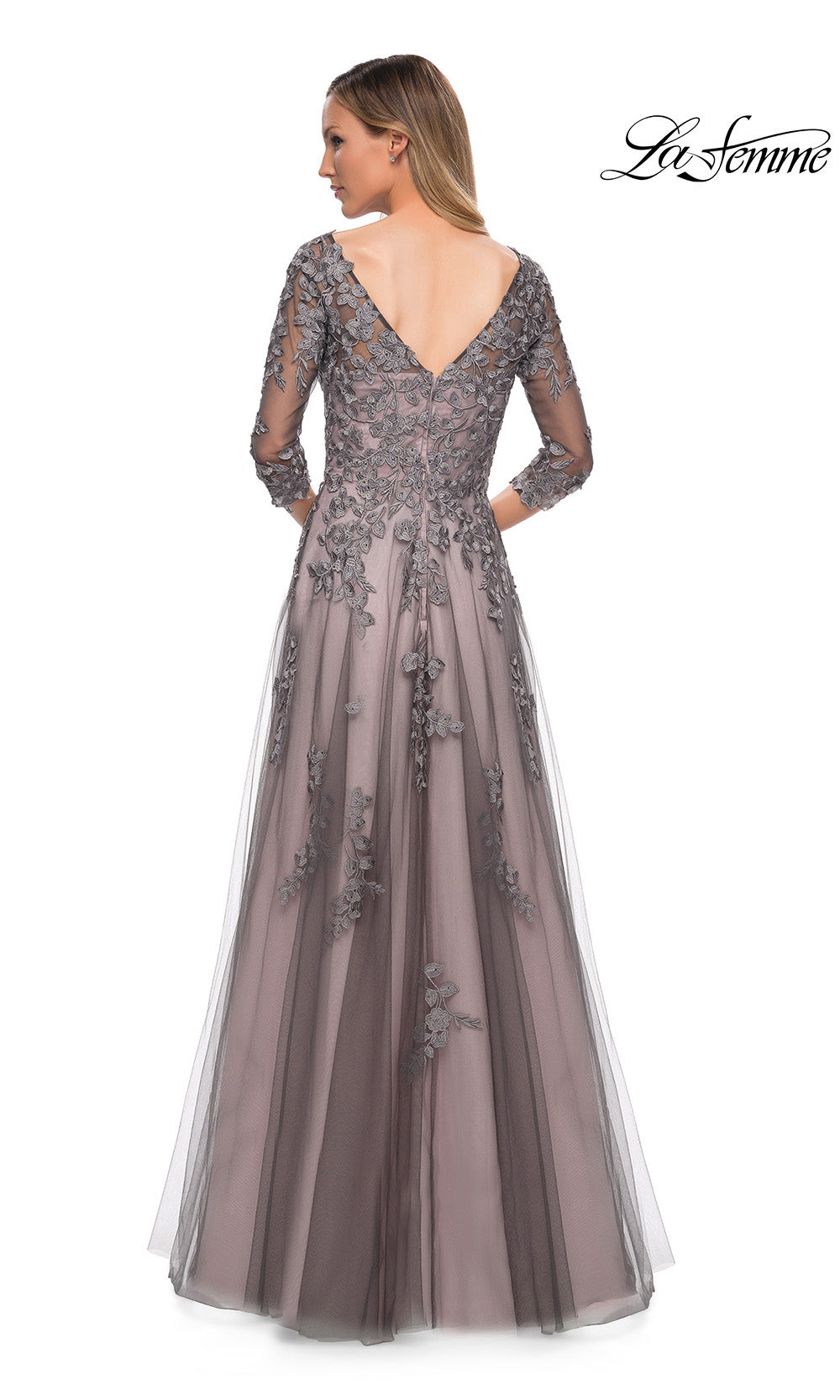 Long, elegant evening gown with floral lace details on a white background