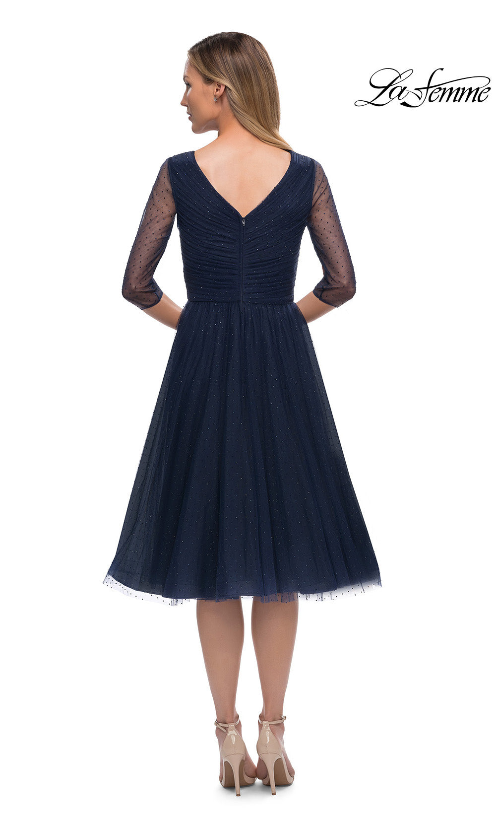 Navy blue dress with sheer sleeves on a white background