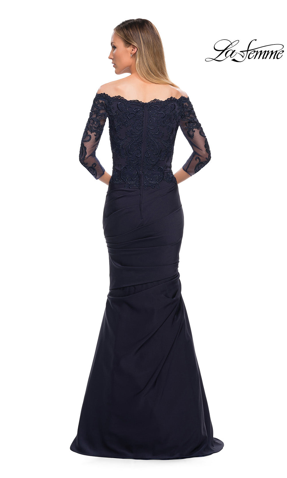 Navy blue off-shoulder evening gown with lace detailing on a white background