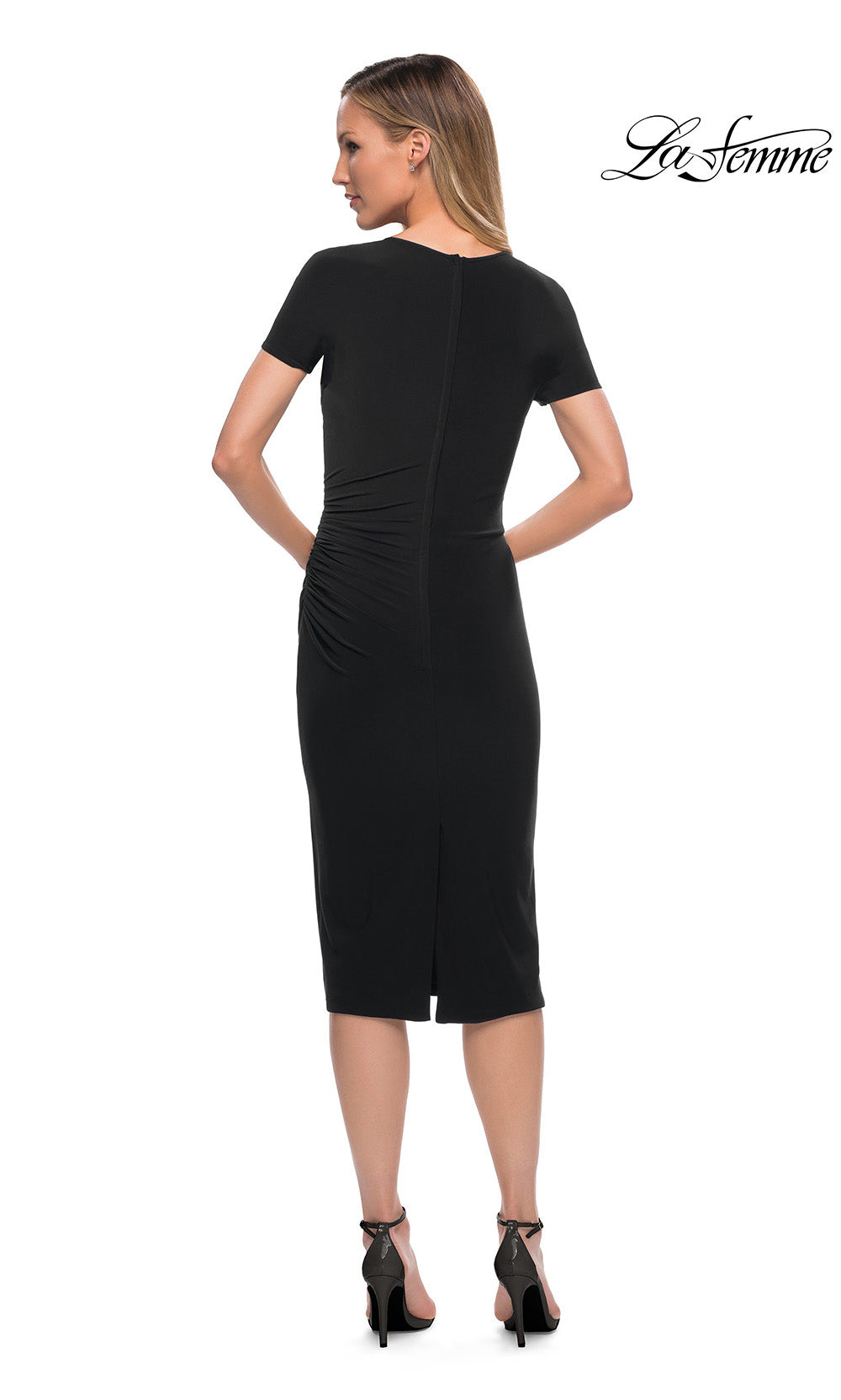 Woman wearing a black dress with a white background