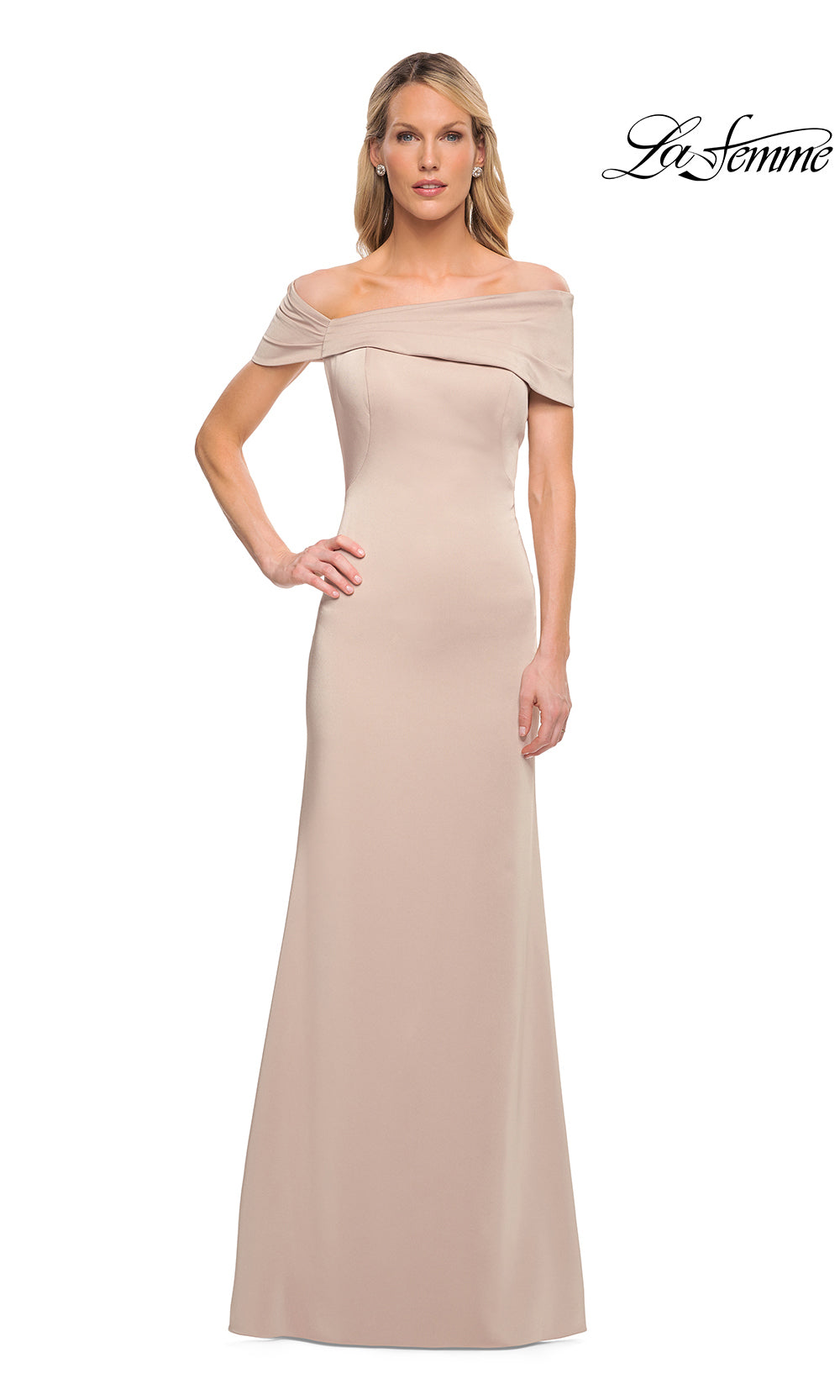 Woman wearing a beige off-shoulder evening gown on a white background