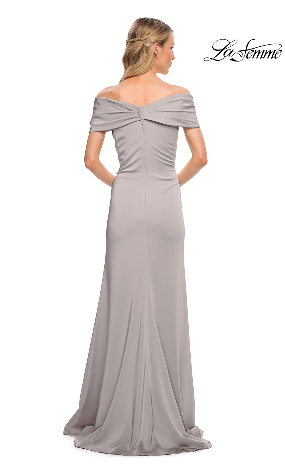 Woman wearing a gray off-shoulder evening gown on a white background