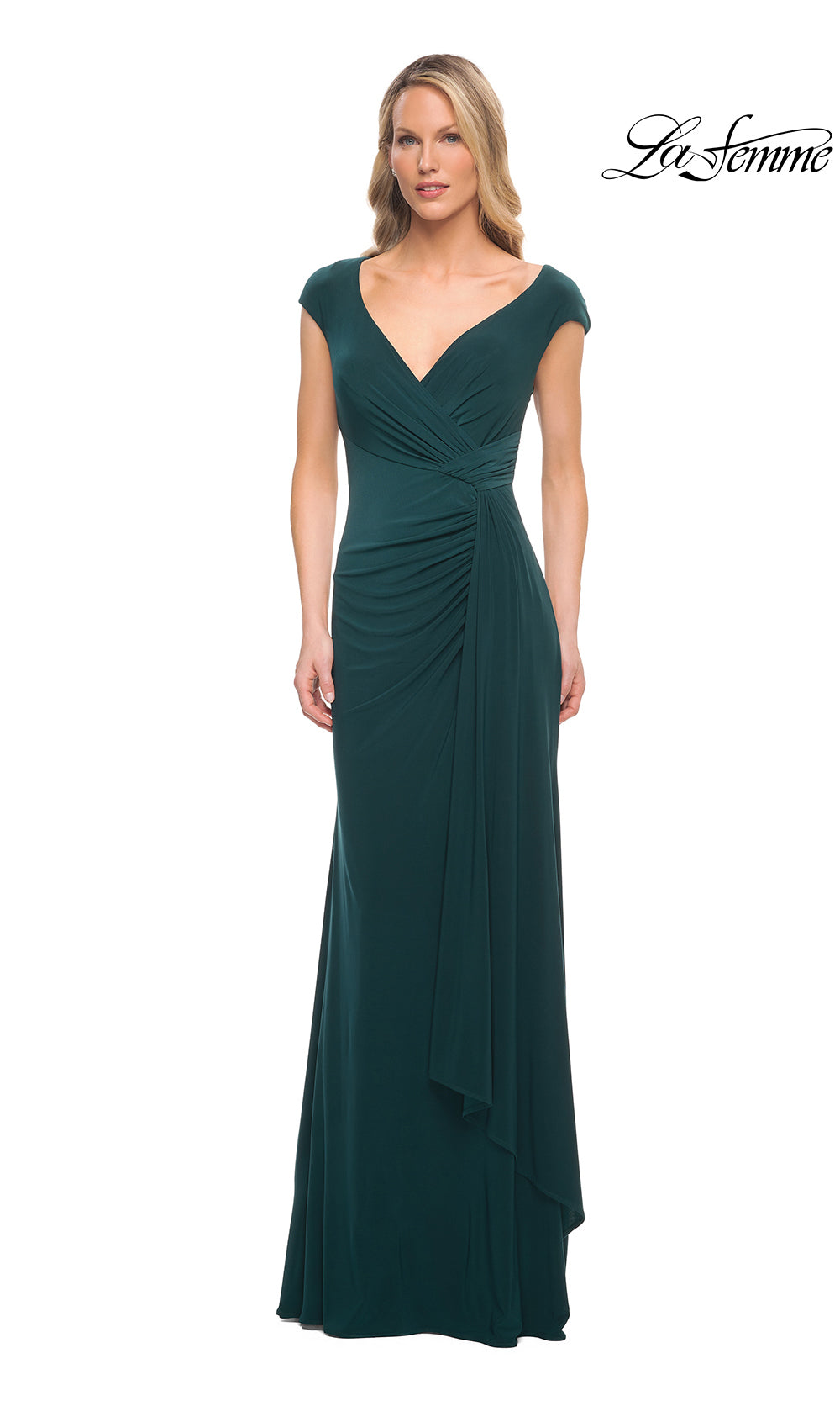 Woman wearing a green evening gown on a white background with 'La Femme' branding.