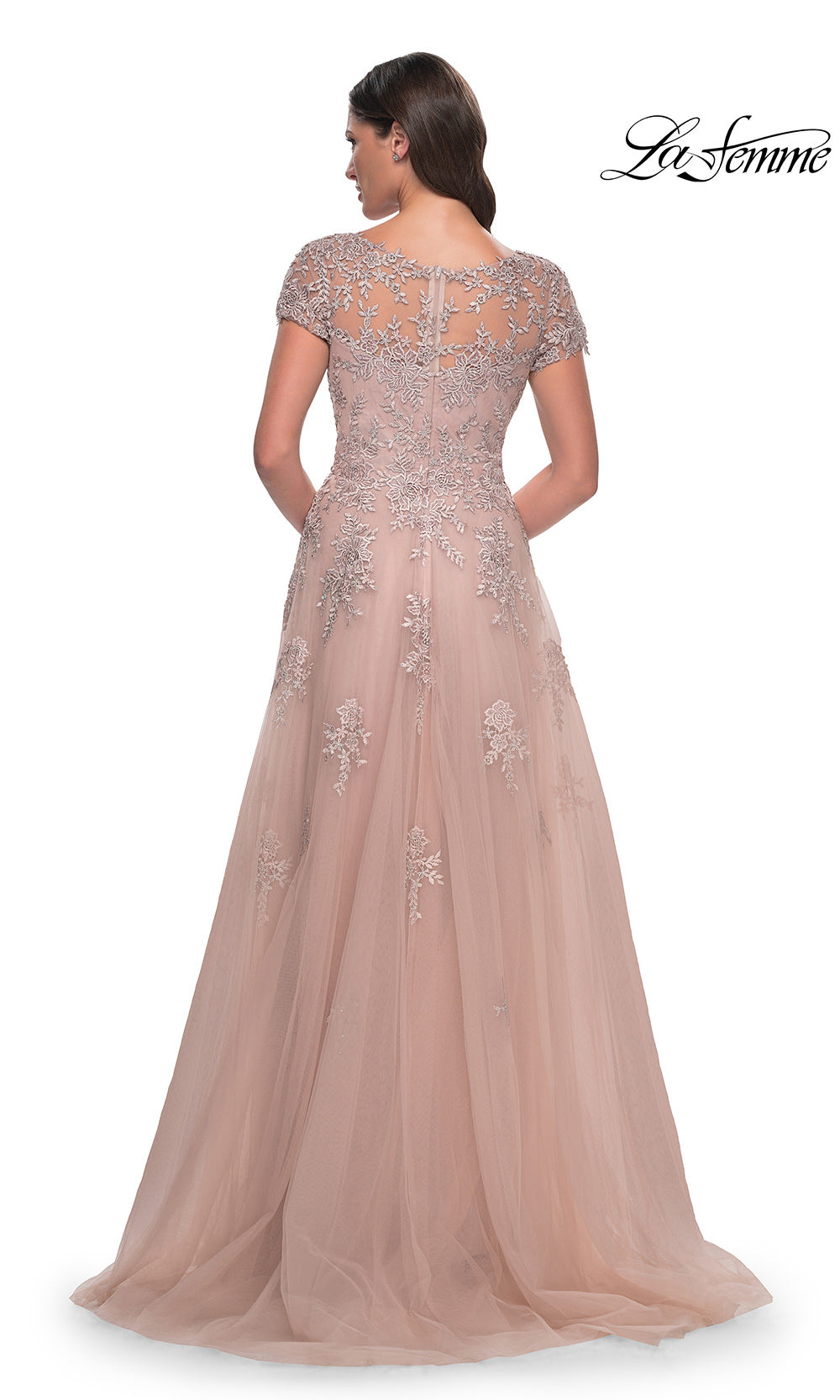 Elegant evening gown with intricate detailing on a white background