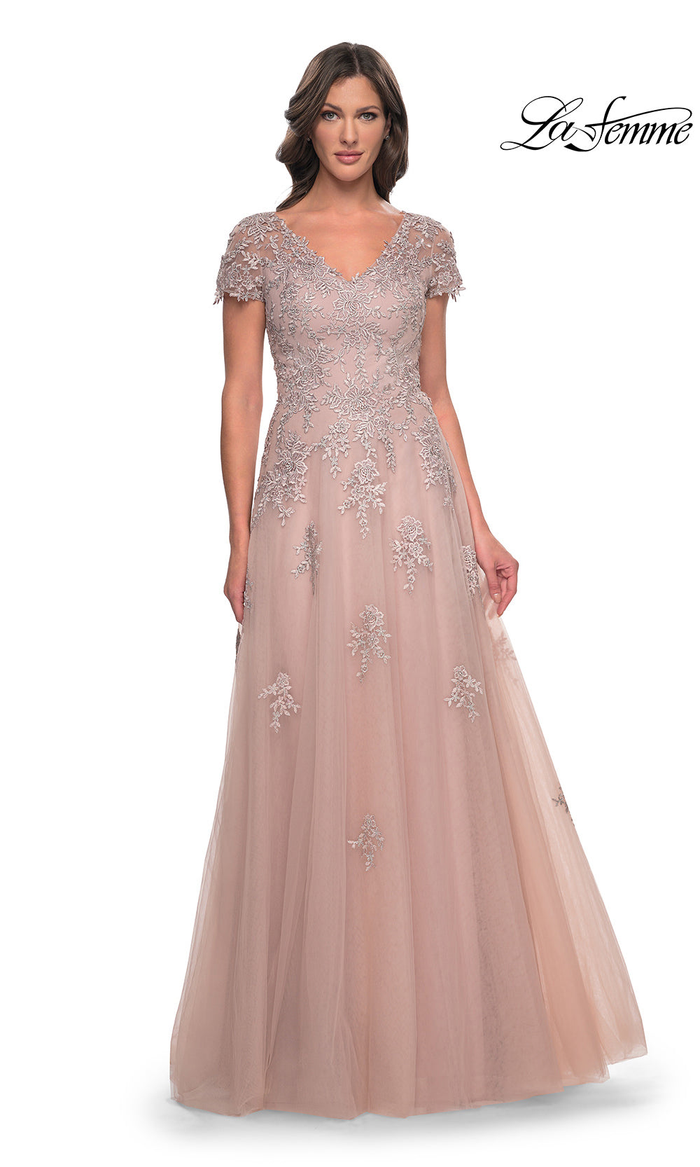 Woman wearing a long, embellished dress on a white background with 'La Femme' branding.