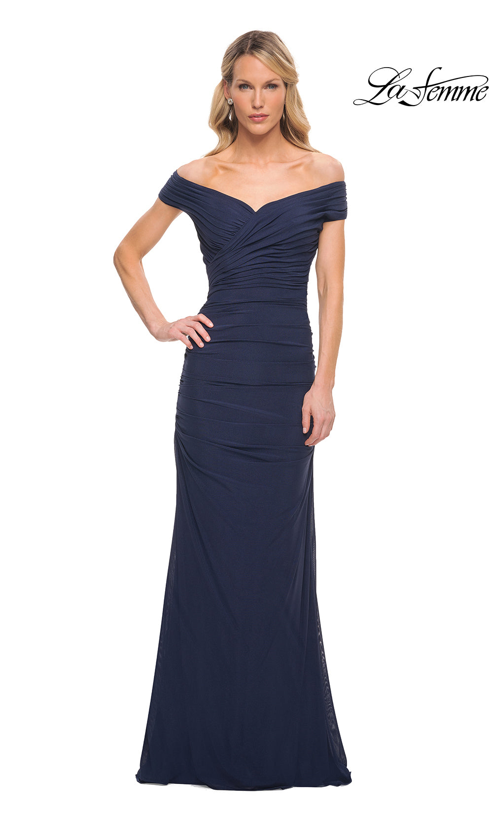 Woman wearing a navy blue off-shoulder evening gown on a white background