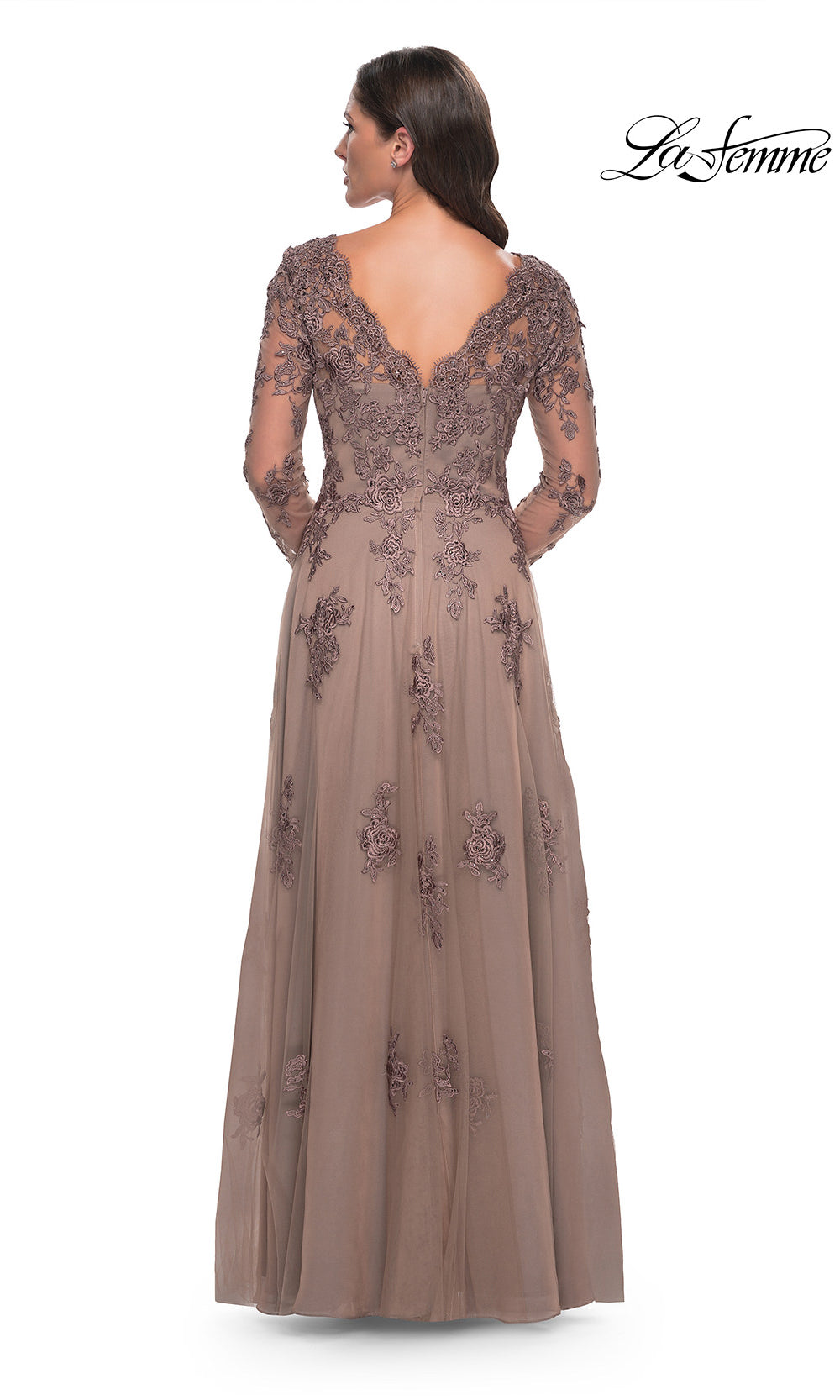 Long, elegant dress with lace detailing on a white background