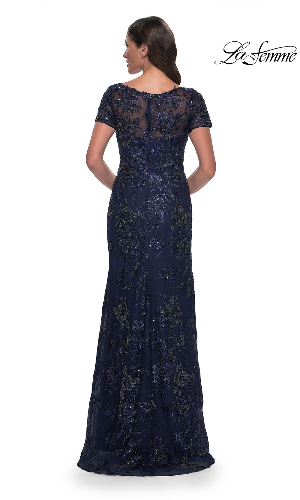 Navy blue lace evening gown on a white background with 'La Femme' branding.