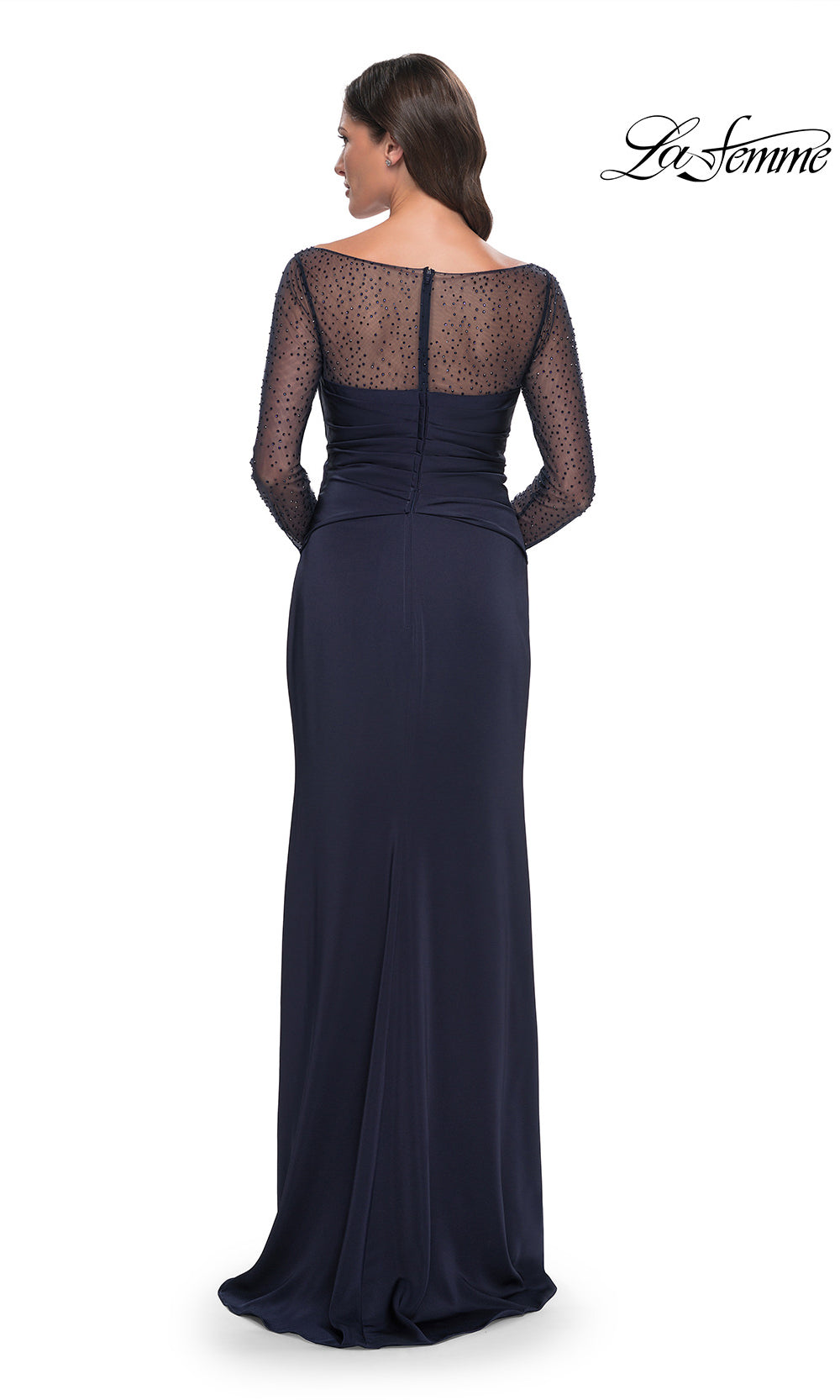 Navy blue evening gown with sheer lace detailing on a white background