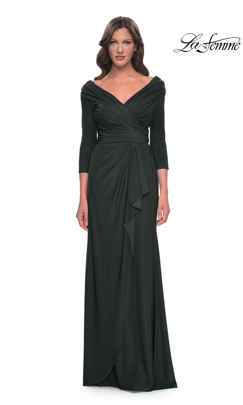 Woman wearing a dark green evening gown with a draped design on a white background, branded 'La Femme'.