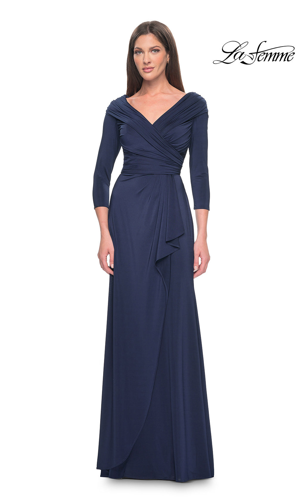 Woman wearing a navy blue evening gown with a draped design on a white background, branded 'La Femme'.