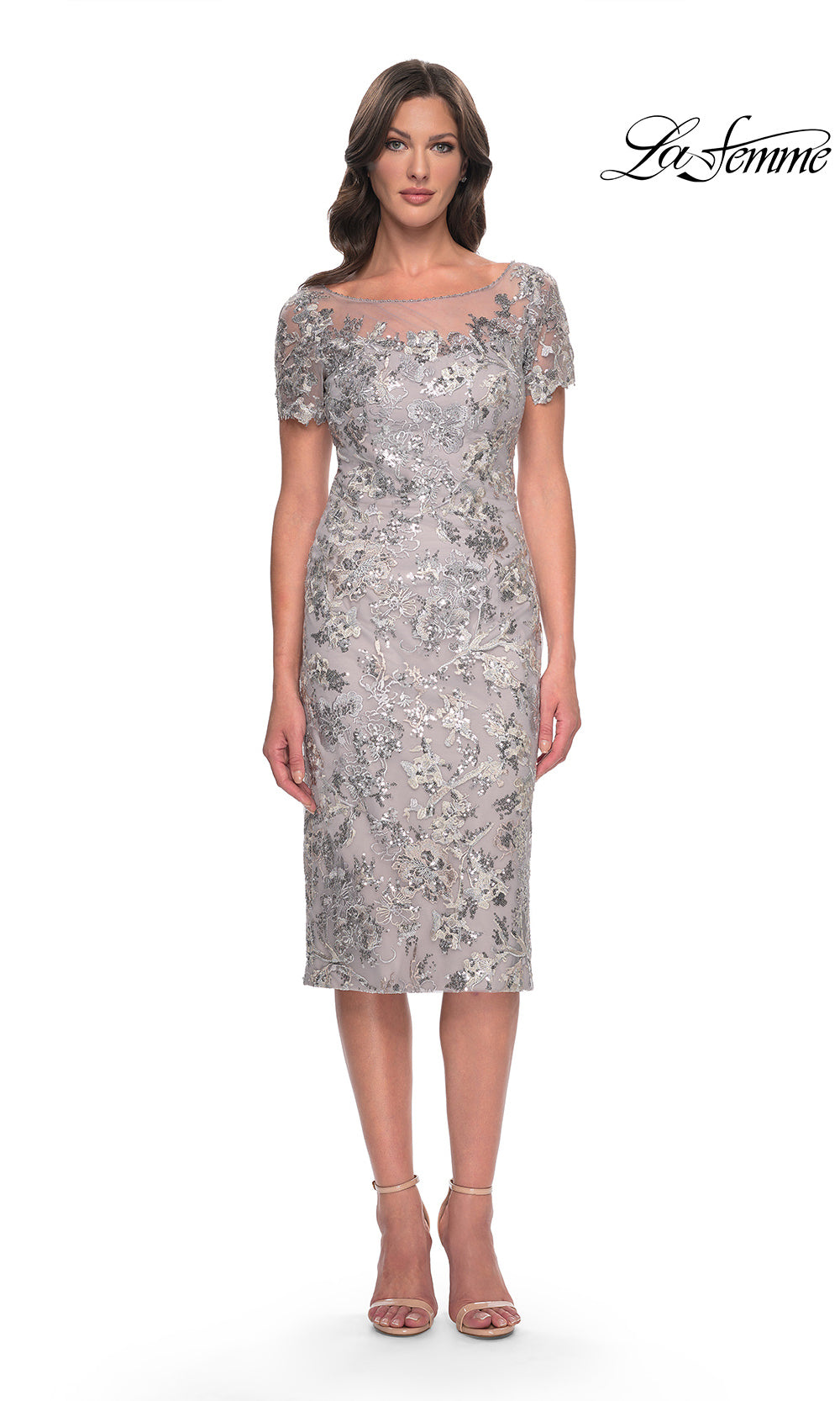 Woman wearing a silver floral dress on a white background with 'La Femme' branding.