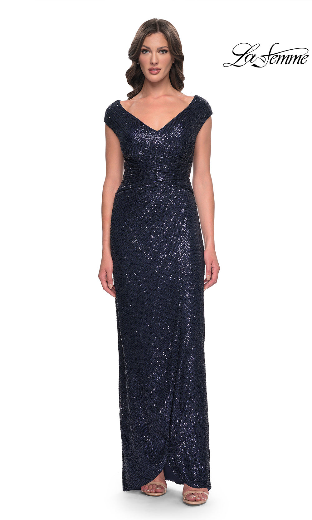 Woman wearing a navy sequin evening gown on a white background