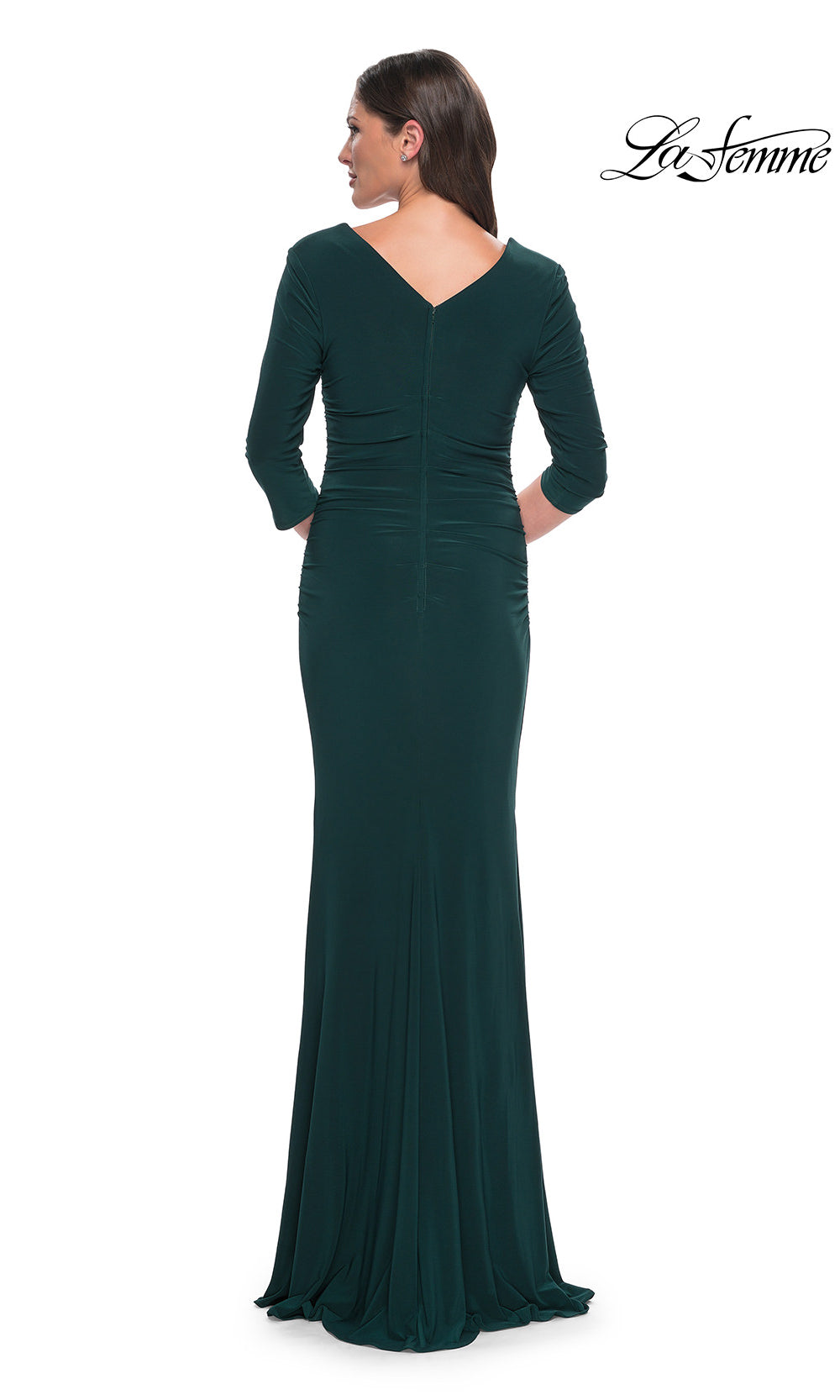 Green evening gown with long sleeves on a white background, brand 'La Femme' visible.