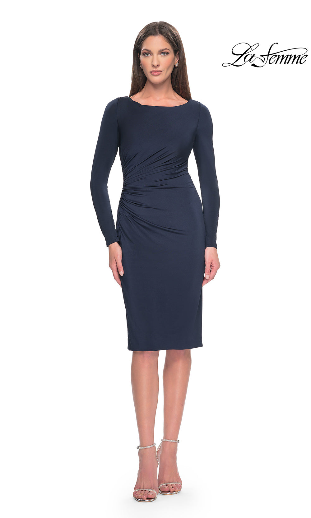 Woman wearing a navy blue dress with long sleeves on a white background