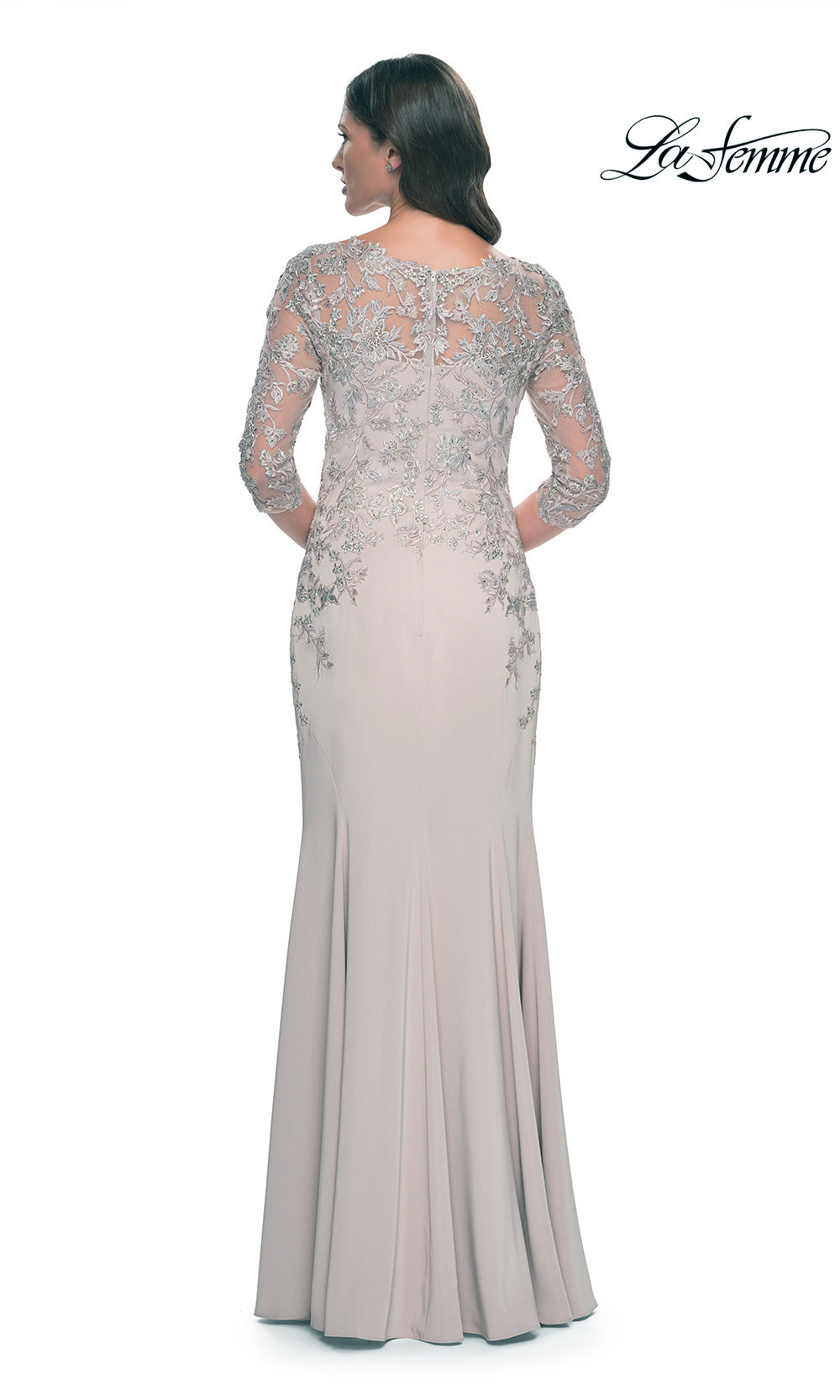Long, elegant dress with lace detailing on a white background
