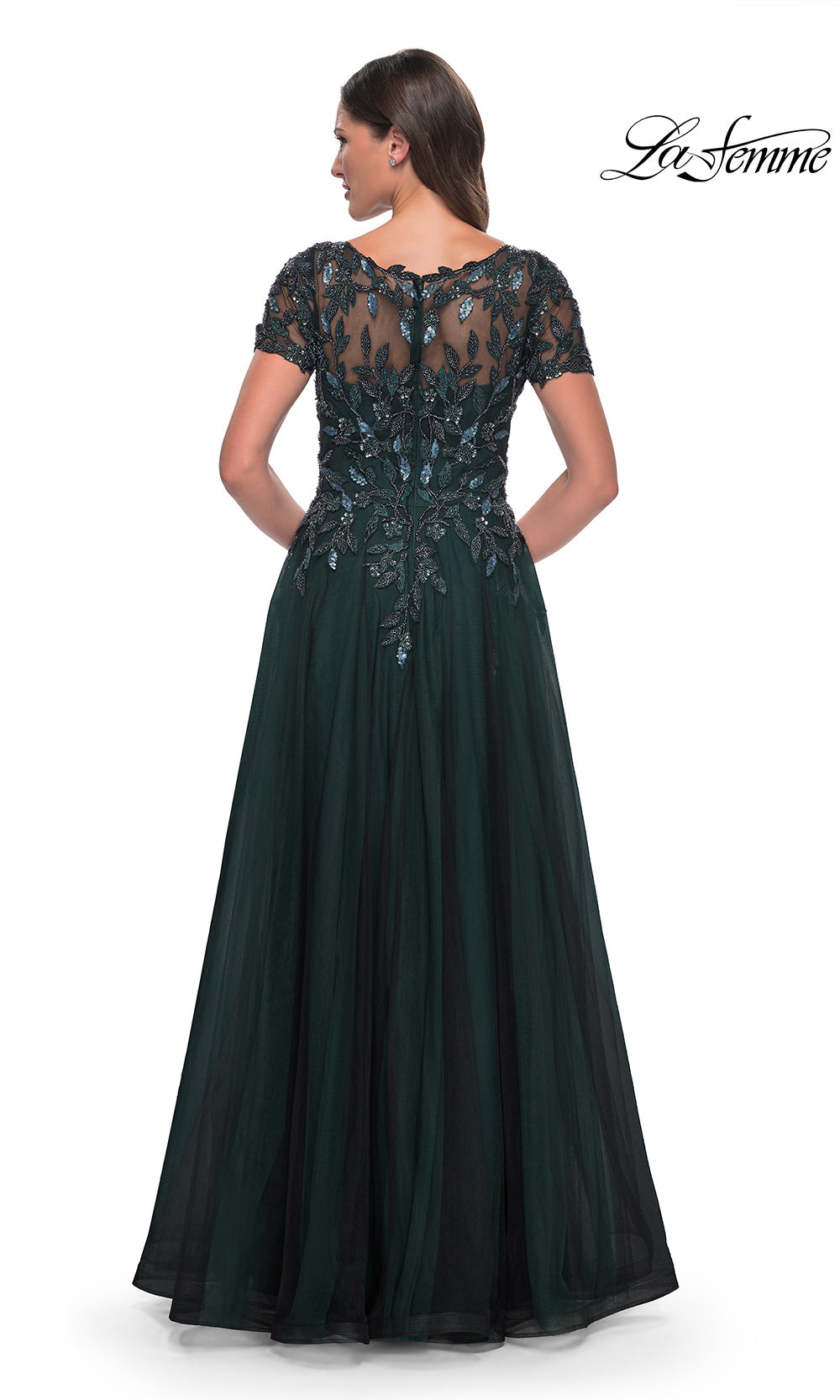 Dark green evening gown with lace detailing on a white background