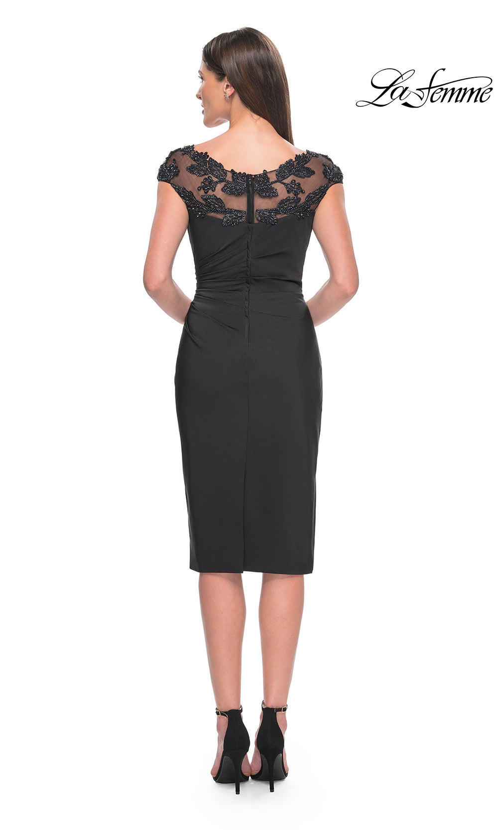 Black dress with lace detailing on a white background