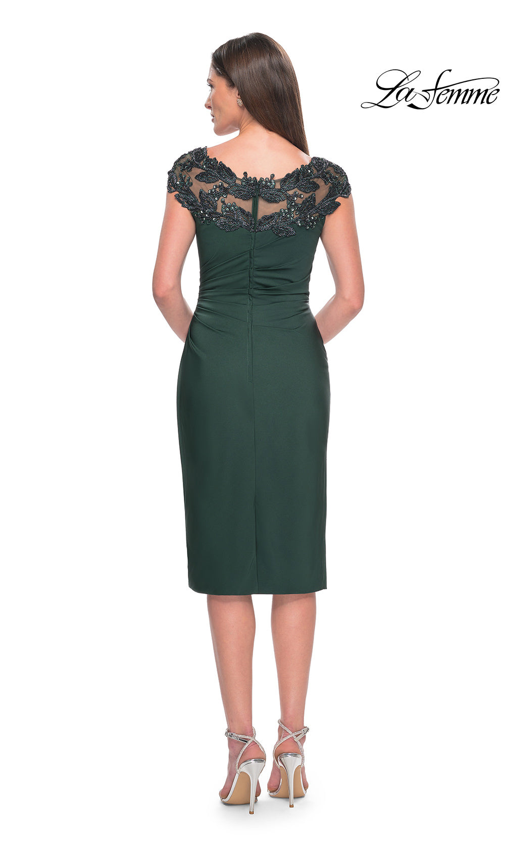 Green dress with lace cap sleeves on a white background, featuring the brand 'La Femme'.