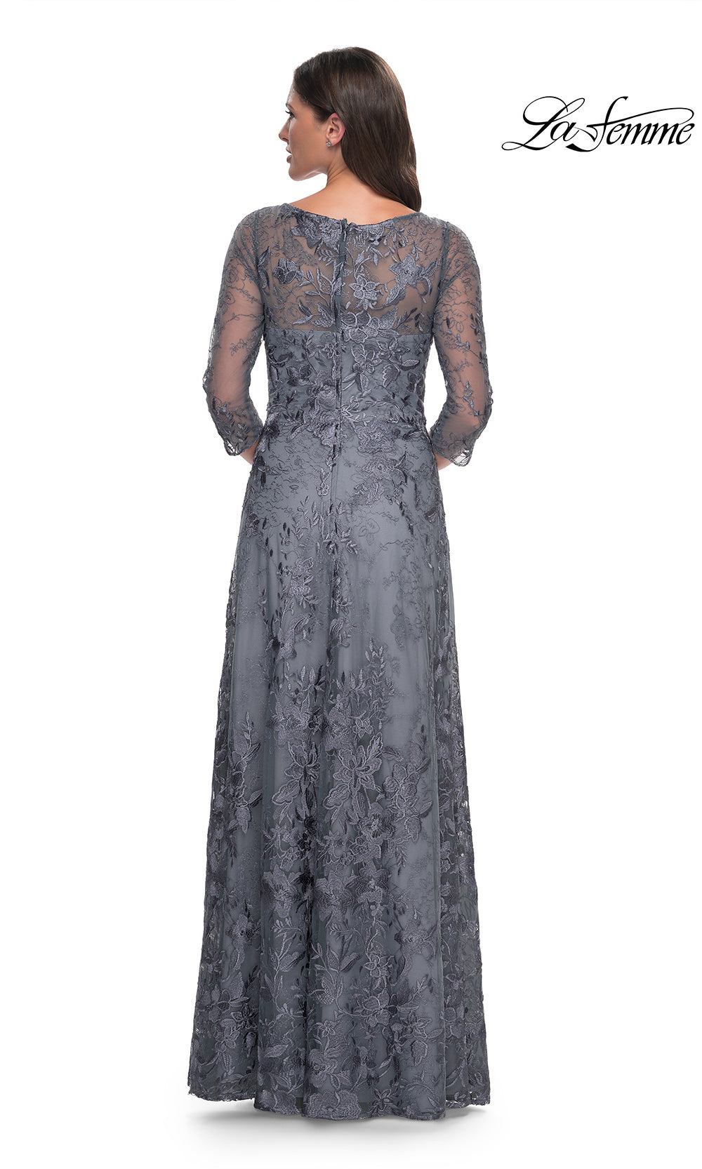 Long lace dress with a subtle pattern on a white background, featuring the brand 'La Femme'.