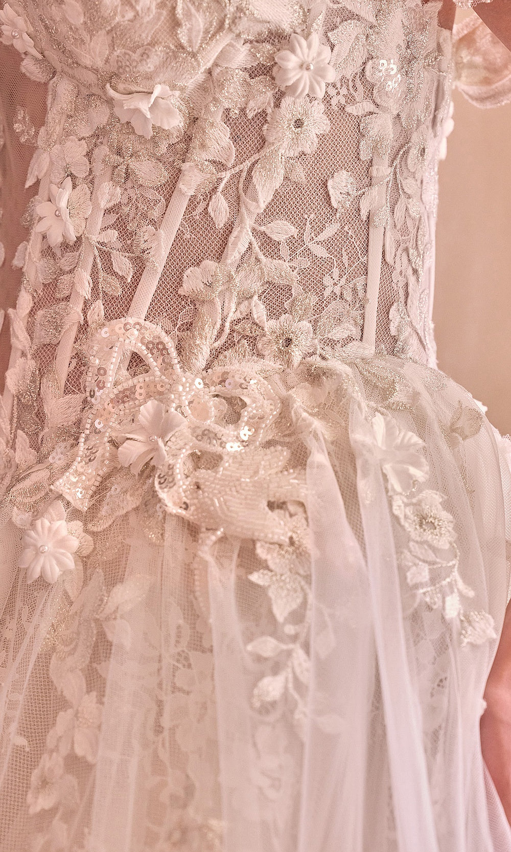 Andrea and Leo WL093 French White wedding dress detail view with sheer boning channels, off-shoulder lace straps, sweetheart neckline close-up, bridal shower styling