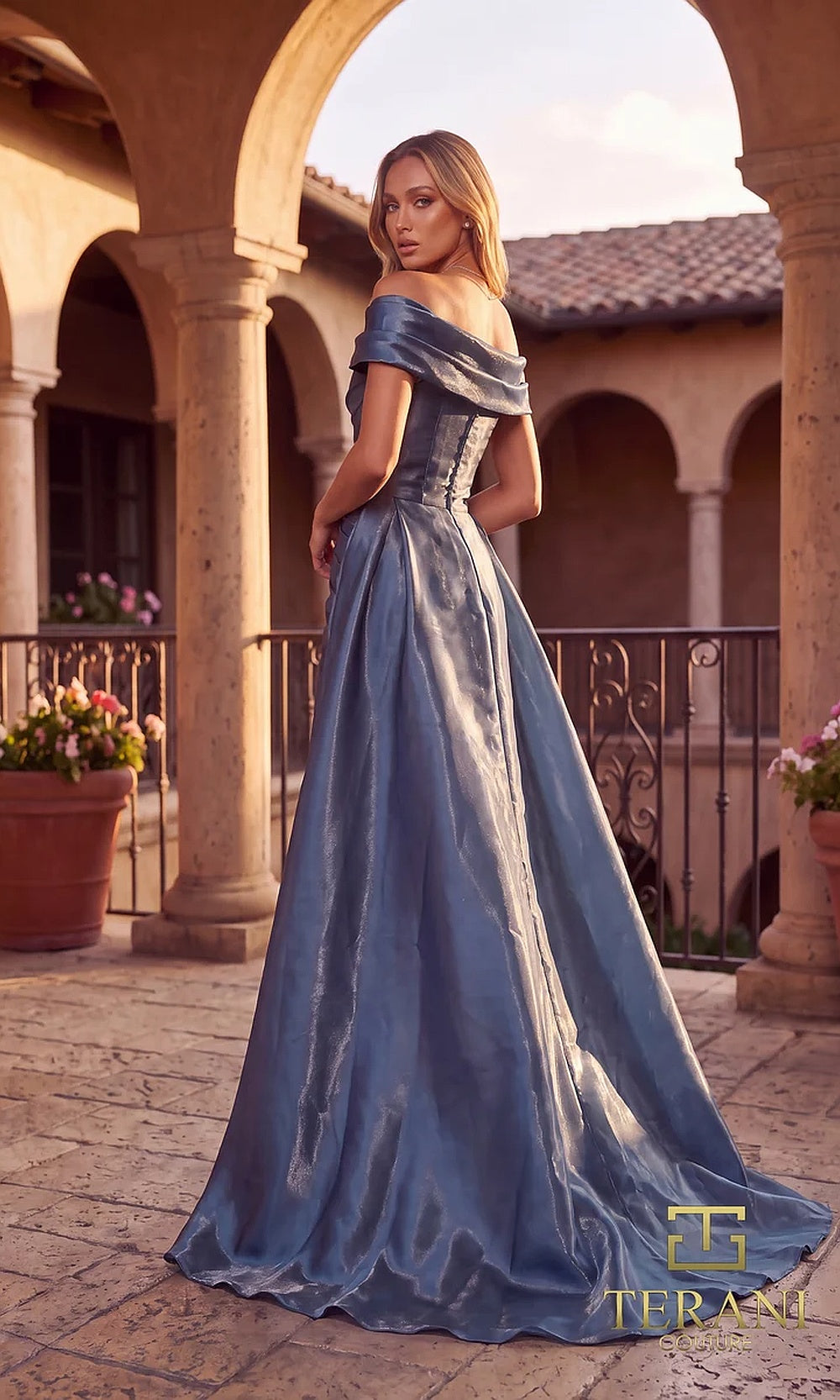 Terani Couture 262M7326 Slate evening gown back view with metallic satin fabric, fully covered high back, zipper closure, and floor-length overskirt, evening gown
