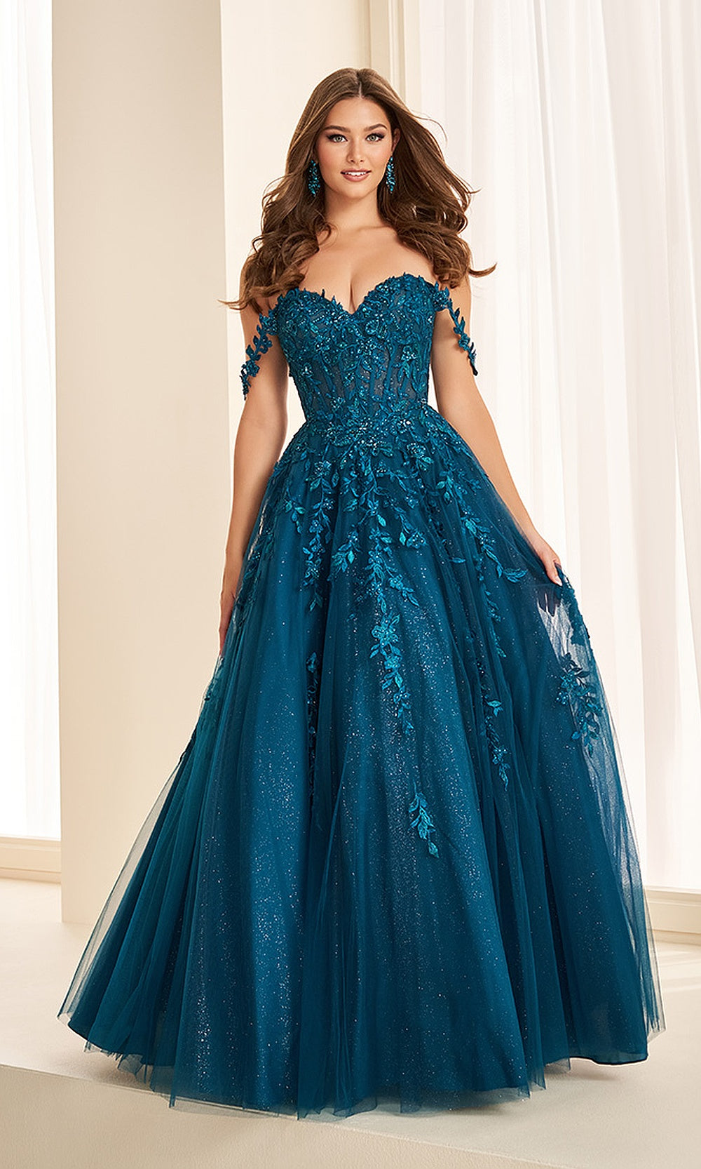 Ellie Wilde EW37028 Dark Teal prom dress front view with lace and tulle, beaded floral appliqués, off-shoulder sweetheart neckline, corset ballgown silhouette, evening gown.