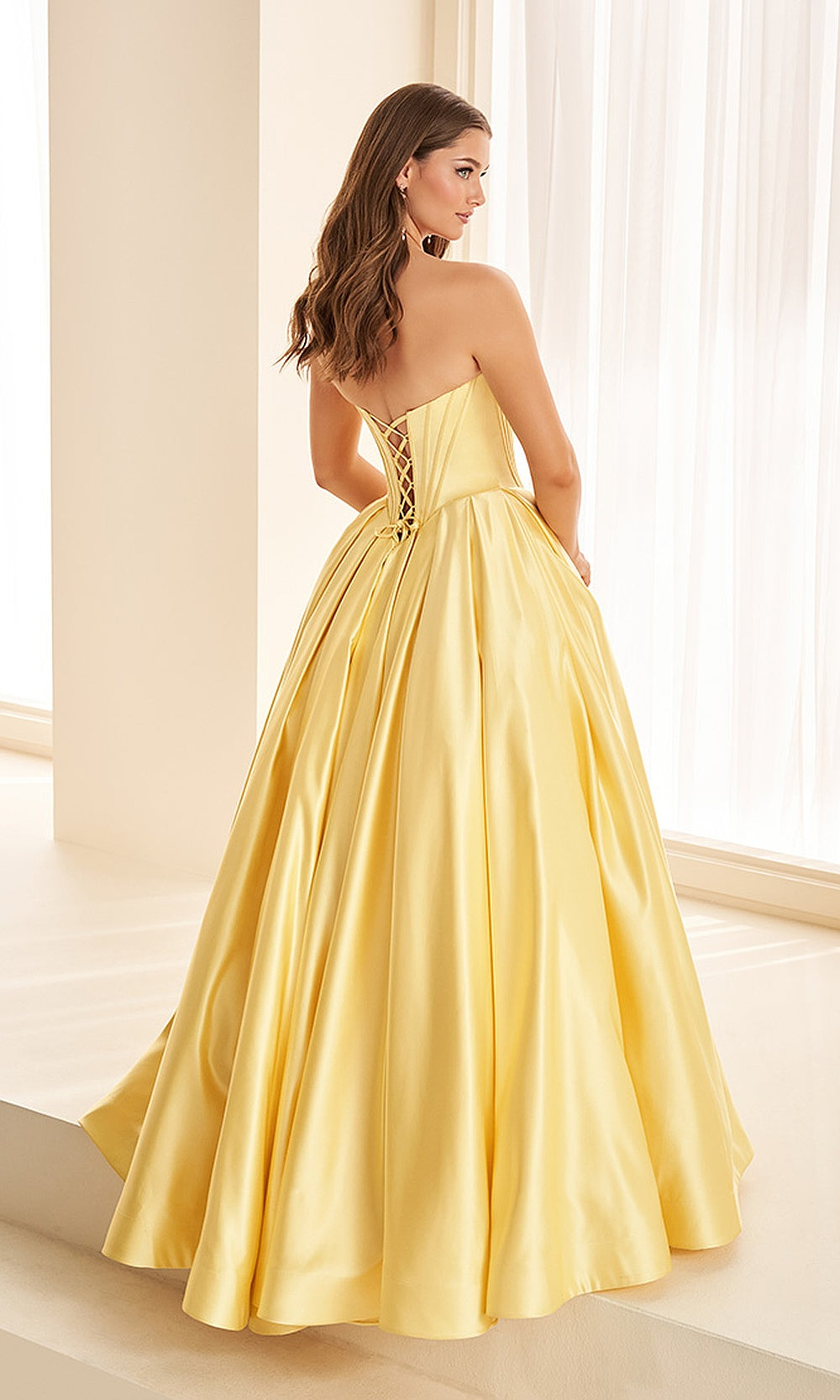 Ellie Wilde EW38020 Light Yellow prom dress back view with beaded satin, lace-up corset back, ballgown silhouette, elegant evening gown.