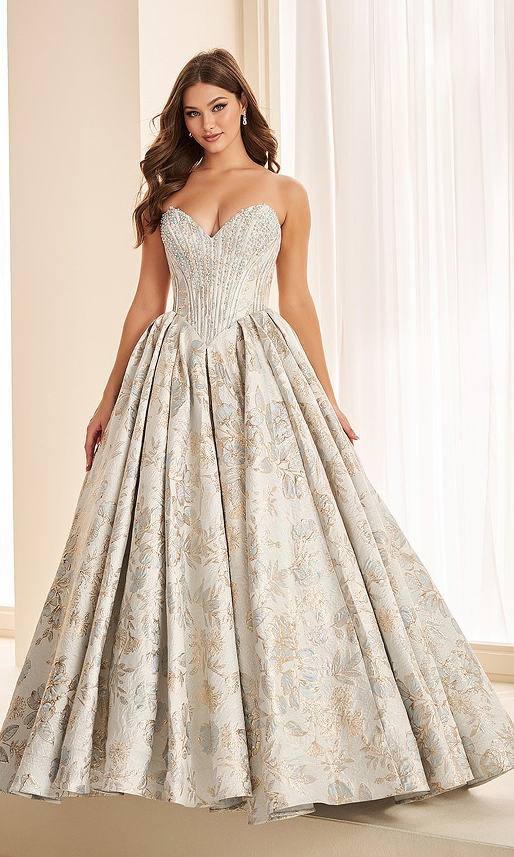 Ellie Wilde EW38042 Dusty Blue Light Gold prom dress front view with beaded print fabric, strapless sweetheart corset bodice, ballgown silhouette, black tie event dress.