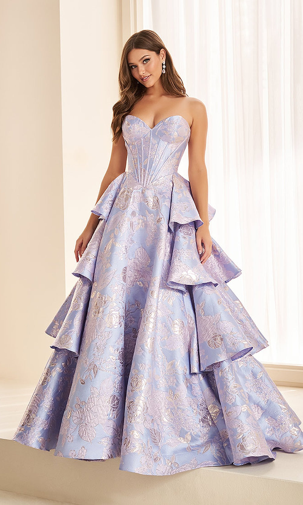 Ellie Wilde EW38045 Lavender Blue prom dress front view with metallic jacquard fabric, one-shoulder neckline, ballgown silhouette, formal prom gown with tiered ruffle skirt.