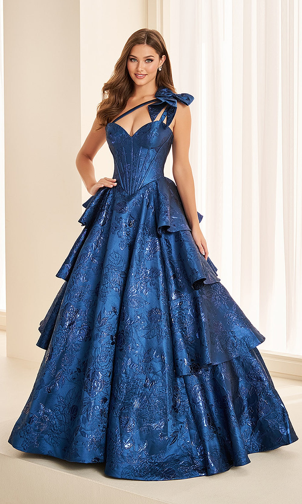 Ellie Wilde EW38045 Peacock prom dress front view with metallic jacquard print, boned one-shoulder corset bodice, a-line ballgown silhouette, black tie event dress with tiered ruffles.