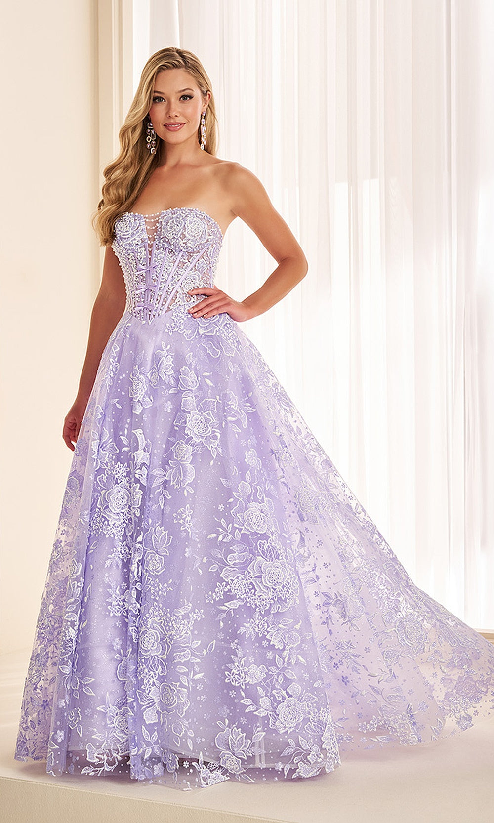 Ellie Wilde EW38046 Lavender prom dress front view with glitter tulle, floral appliques, strapless sweetheart boned ballgown, pageant-ready gown.